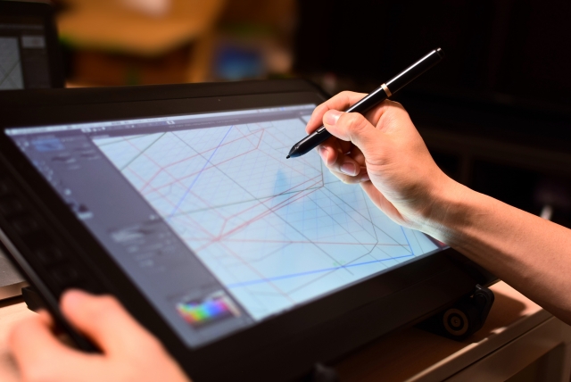 液晶タブレットでイラストを描く人